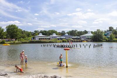 People play in the recreational lake at the Europarcs EuroParcs Zilverstrand holiday park