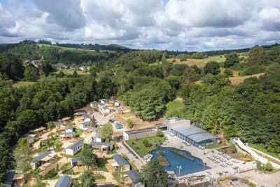 Aerial view of the Roompot Parc la Clusure holiday park with the outdoor pool and chalets