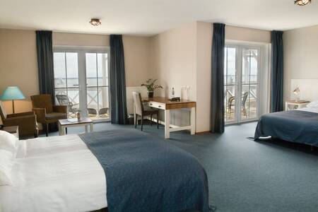 Slaapkamer van een hotelkamer op vakantiepark Roompot Cape Helius
