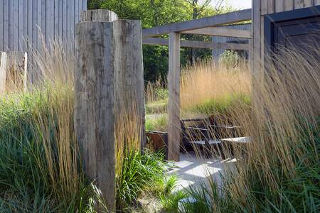 Tuin van een Duinlodge op vakantiepark Roompot Noordzee Resort Vlissingen