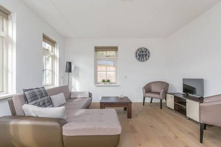 Woonkamer van een vakantiehuis op vakantiepark Roompot Villaparc Schoonhovenseland